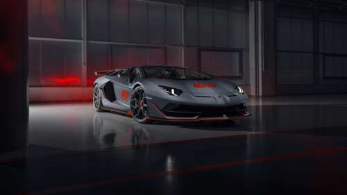 A sleek and powerful silver Lamborghini Aventador SVJ supercar showcasing its aerodynamic... 8K free background images