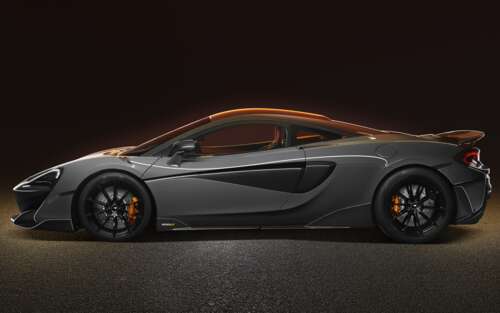 A high-resolution view of a silver McLaren 600LT supercar showcasing its aerodynamic... free wallpaper
