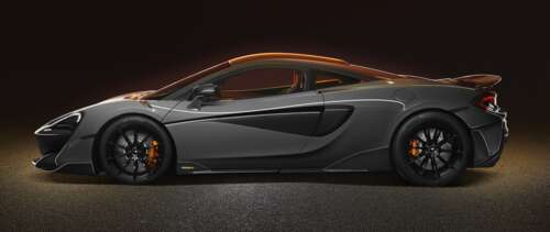 A high-resolution view of a silver McLaren 600LT supercar showcasing its aerodynamic... UWUHD free hd wallpapers