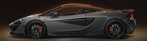 A high-resolution view of a silver McLaren 600LT supercar showcasing its aerodynamic... Dual UHD free desktop wallpaper