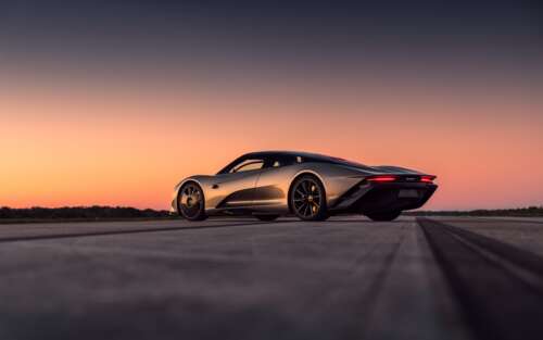 A silver McLaren Speedtail supercar parked under a beautiful sunset sky. 7680x4800 wallpaper images
