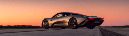 A silver McLaren Speedtail supercar parked under a beautiful sunset sky. Dual UHD wallpaper for pc download