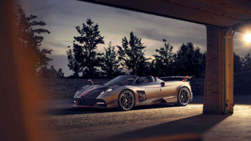 A sleek, silver Pagani Huayra supercar featuring a polished metallic finish and aerodynamic... 4K (Ultra HD) free hd wallpapers