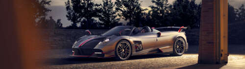 A sleek, silver Pagani Huayra supercar featuring a polished metallic finish and aerodynamic... Dual UHD ps4 wallpaper