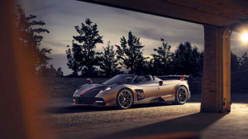 A sleek, silver Pagani Huayra supercar featuring a polished metallic finish and aerodynamic... 8K pictures for wallpaper