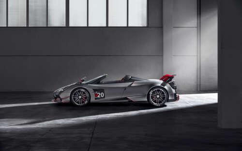 A high-detail shot of a polished silver Pagani Huayra supercar. 7680x4800 free hd wallpapers