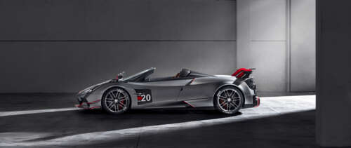 A high-detail shot of a polished silver Pagani Huayra supercar. UWUHD wallpaper download