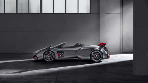 A high-detail shot of a polished silver Pagani Huayra supercar. 8K wallpaper images