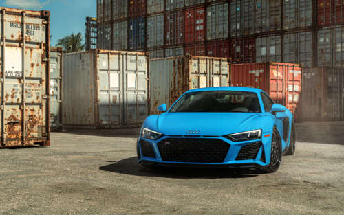 A detailed shot of a sleek Audi R8 supercar featuring its iconic aerodynamic design... 7680x4800