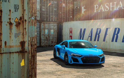 A high-performance Audi R8 supercar featuring an aerodynamic design and metallic... 7680x4800 wallpaper