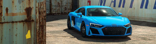 A high-performance Audi R8 supercar featuring an aerodynamic design and metallic... Dual UHD desktop wallpaper