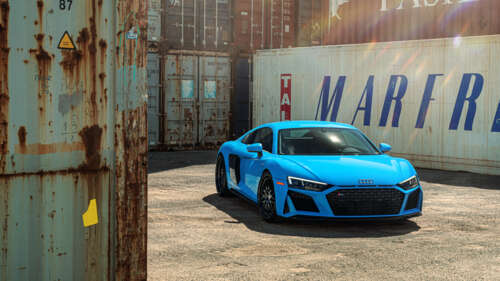 A high-performance Audi R8 supercar featuring an aerodynamic design and metallic... 8K high definition wallpaper