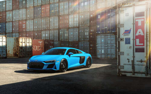 A close-up shot of a high-performance Audi R8 supercar featuring a streamlined design... 7680x4800