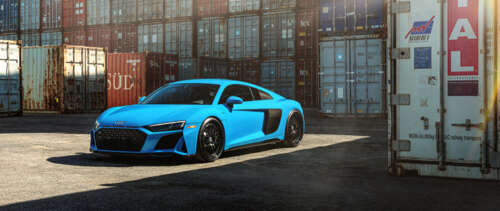 A close-up shot of a high-performance Audi R8 supercar featuring a streamlined design... UWUHD wallpaper download
