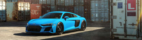 A close-up shot of a high-performance Audi R8 supercar featuring a streamlined design... Dual UHD free desktop wallpaper