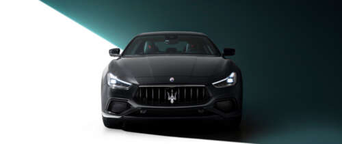 A high-end black Maserati Ghibli featuring a polished, sleek automotive design. UWUHD wallpaper for laptop download