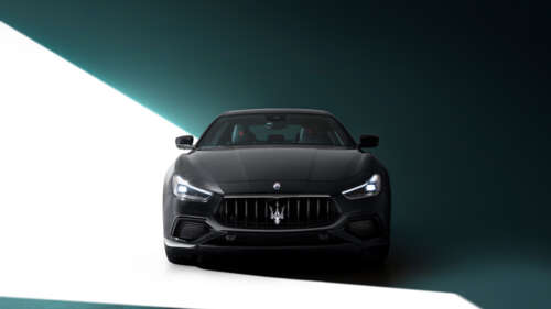 A high-end black Maserati Ghibli featuring a polished, sleek automotive design. 8K free wallpaper