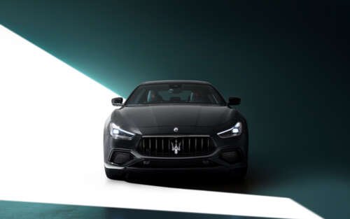 A high-end black Maserati Ghibli featuring a polished, sleek automotive design. 7680x4800 wallpaper images
