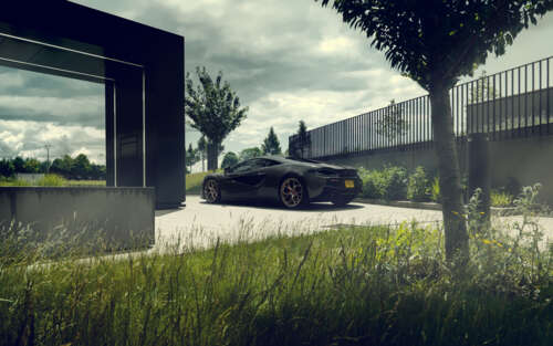 A glossy black McLaren 570S supercar featuring aerodynamic lines and a premium finish. 7680x4800 free desktop wallpaper