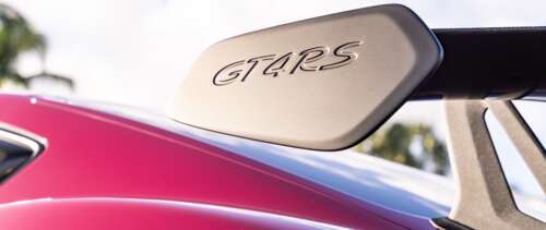 A detailed close-up of a polished Porsche sports car featuring sleek lines and reflective... UWUHD pictures for wallpaper
