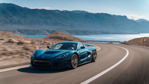 A high-performance Rimac Nevera electric supercar featuring a sleek, aerodynamic... 8K wallpaper for laptop download