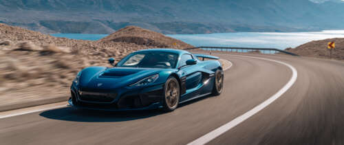 A high-performance Rimac Nevera electric supercar featuring a sleek, aerodynamic... UWUHD wallpaper images