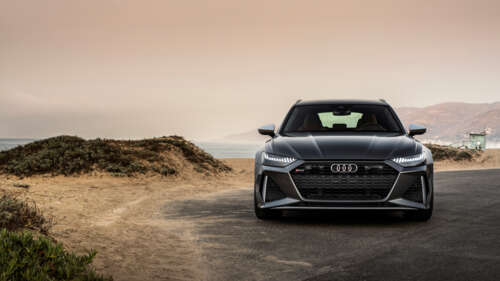 A close-up view of a metallic silver Audi RS6 Avant displaying its sleek and aerodynamic... 8K pictures for wallpaper