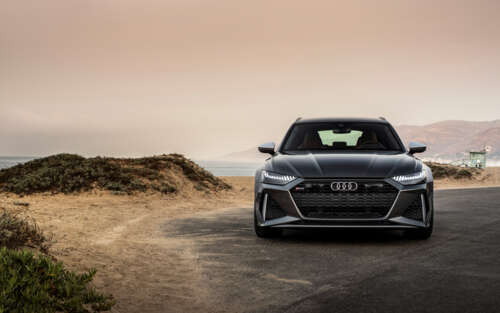 A close-up view of a metallic silver Audi RS6 Avant displaying its sleek and aerodynamic... 7680x4800 computer backgrounds