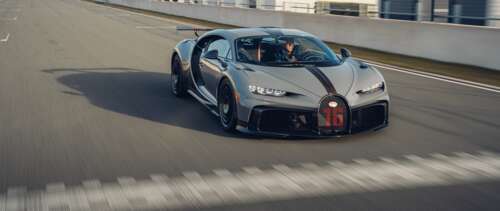 A high-performance silver Bugatti Chiron Pur Sport supercar featuring metallic finish... UWUHD
