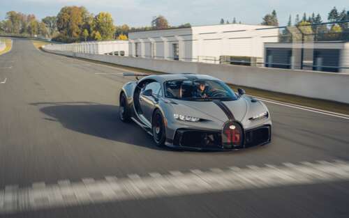 A high-performance silver Bugatti Chiron Pur Sport supercar featuring metallic finish... 7680x4800 desktop wallpaper