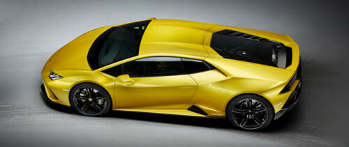 A vibrant yellow Lamborghini Huracan Evo supercar highlighting its sleek, aerodynamic... UWUHD wallpaper for pc download