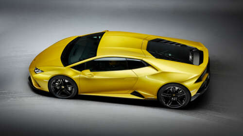 A vibrant yellow Lamborghini Huracan Evo supercar highlighting its sleek, aerodynamic... 8K