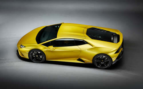 A vibrant yellow Lamborghini Huracan Evo supercar highlighting its sleek, aerodynamic... 7680x4800 ps4 wallpaper