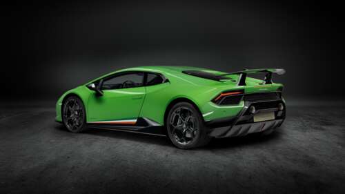 A close-up shot of a bright green Lamborghini Huracan Performante supercar. free wallpaper