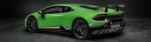 A close-up shot of a bright green Lamborghini Huracan Performante supercar. Dual UHD free wallpaper