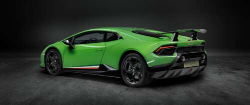 A close-up shot of a bright green Lamborghini Huracan Performante supercar. UWUHD wallpaper images