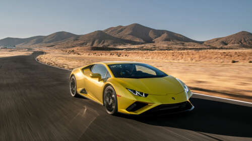 A sleek, bright yellow Lamborghini Huracán Evo showcasing its aerodynamic supercar... 4K (Ultra HD) wallpaper