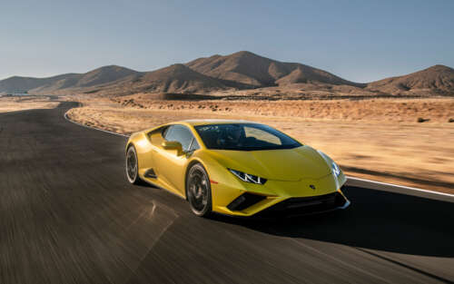 A sleek, bright yellow Lamborghini Huracán Evo showcasing its aerodynamic supercar... 7680x4800 background images hd