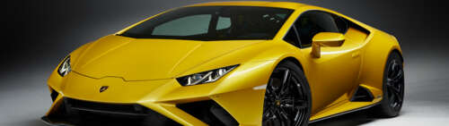 A high-performance yellow Lamborghini Huracan Evo supercar showcasing its sleek and... Dual UHD wallpaper