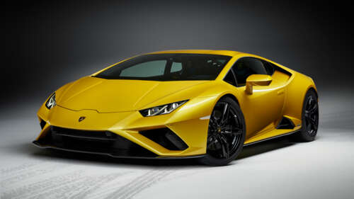 A high-performance yellow Lamborghini Huracan Evo supercar showcasing its sleek and... 8K desktop wallpaper