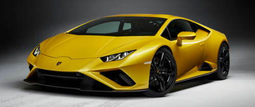 A high-performance yellow Lamborghini Huracan Evo supercar showcasing its sleek and... UWUHD background images hd