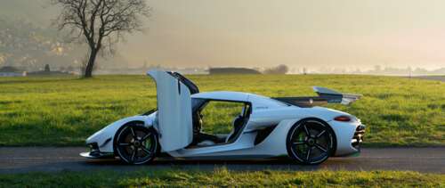 A sleek white Koenigsegg Jesko hypercar showcasing its aerodynamic curves and luxury... UWUHD wallpaper photo gallery download