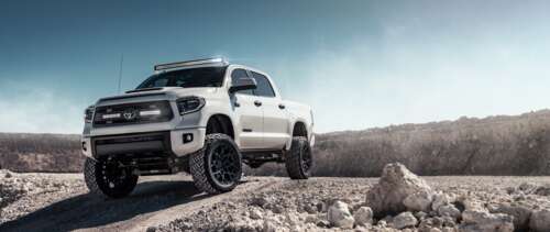 A high-resolution view of a white Toyota Tundra vehicle. UWUHD wallpaper download