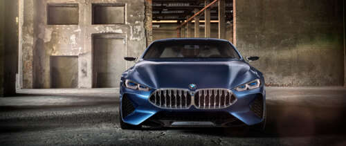 A sleek and futuristic BMW Concept 8 Series luxury car showcasing advanced aerodynamic... UWUHD wallpaper for pc download