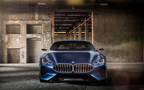 A sleek and futuristic BMW Concept 8 Series luxury car showcasing advanced aerodynamic...