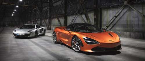 Two McLaren 720S supercars, one in metallic silver and one in bright orange, positioned...