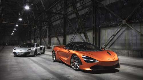Two McLaren 720S supercars, one in metallic silver and one in bright orange, positioned...