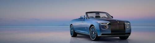 A detailed view of a Rolls-Royce Boat Tail showcasing vibrant reflections and sleek... wallpaper