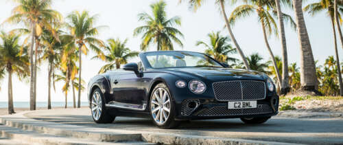 A luxury black Bentley Continental GT convertible showcasing its sleek and polished... UWUHD wallpaper for pc download