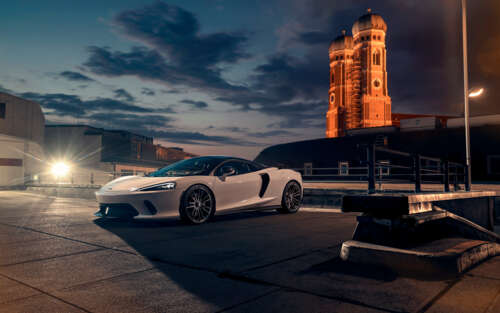 A sleek white McLaren GT supercar featuring modern aerodynamic design and luxury... 7680x4800 free wallpaper for computer